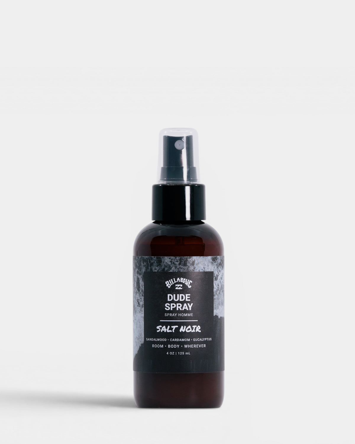 Dark amber glass spray bottle with black label reading "Dude Spray Salt Noir" by Billabong, 4 oz size.