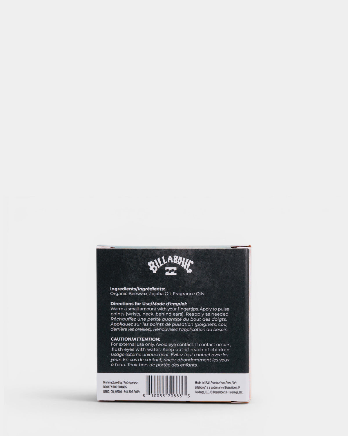 Black Billabong box containing solid cologne with ingredient list and usage instructions visible on back.