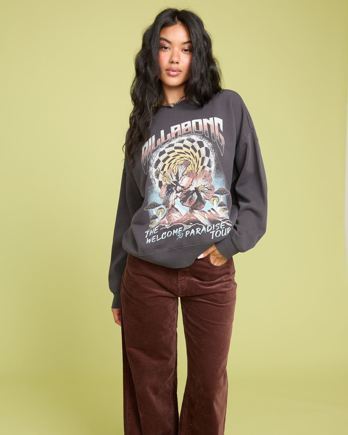 Black crewneck sweatshirt with graphic print featuring "Billabong" text and desert imagery on front.