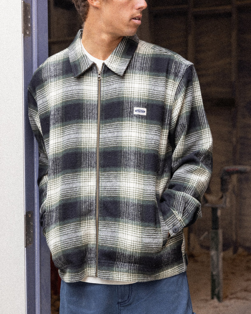 Black and white plaid jacket with collar and full-length zip, worn over white shirt.